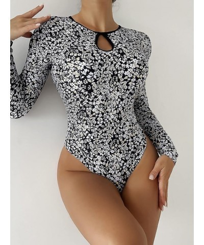 Women's Tropical Long Sleeve One Piece Swimsuit Cut Out Cirss Cross Back Bathing Suit Black and White a $17.28 Swimsuits